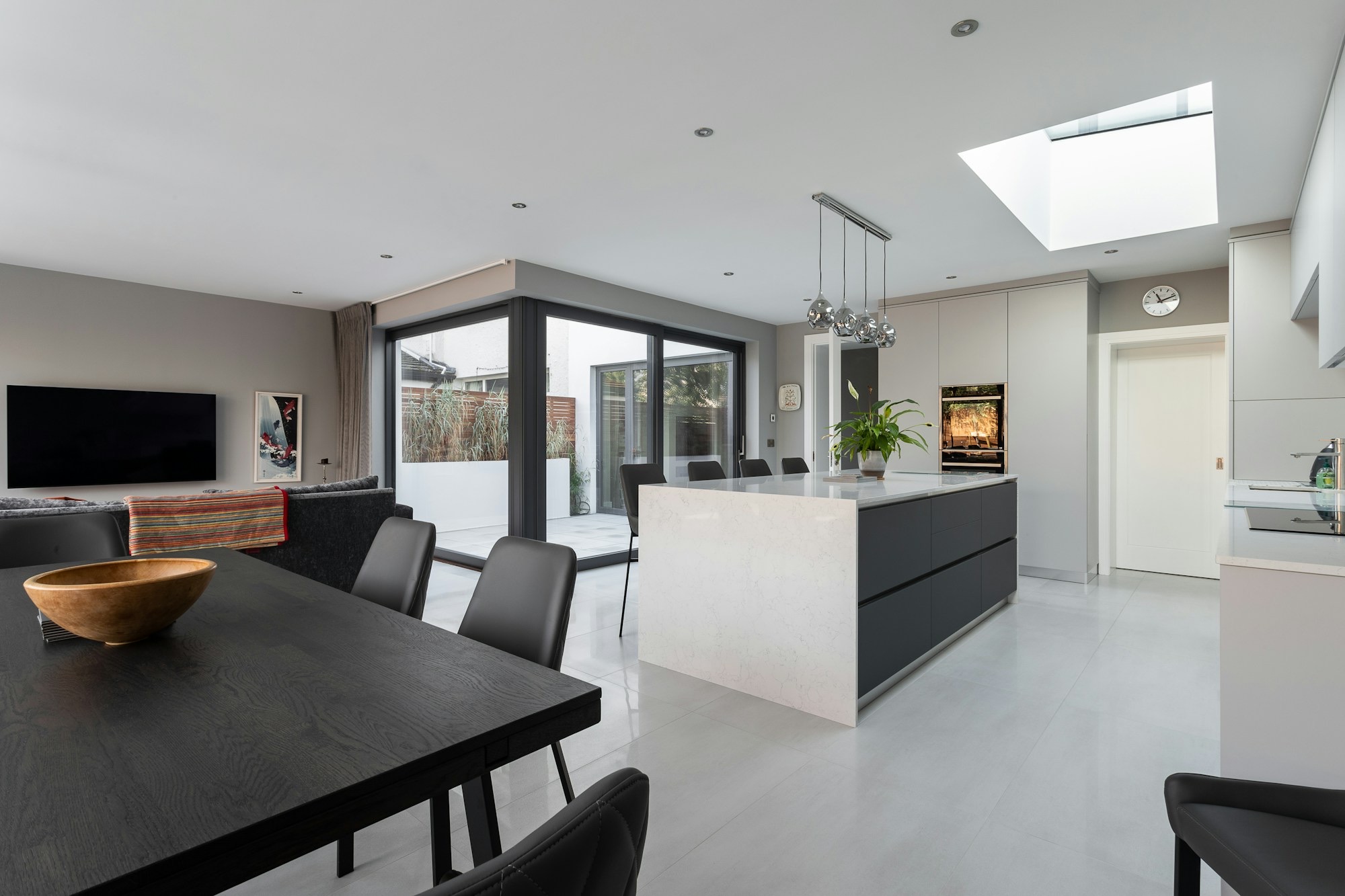 Kitchen side-return extension with rooflight and glazed corner