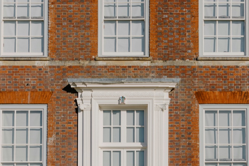 Georgian red-brick facade with sash windows and doorcase